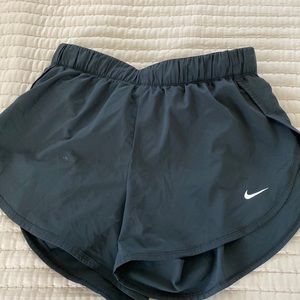 Black dri-fit Nike shorts with lining.